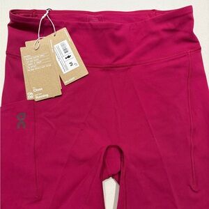 On Running Pink shorts 6 inch inseam.